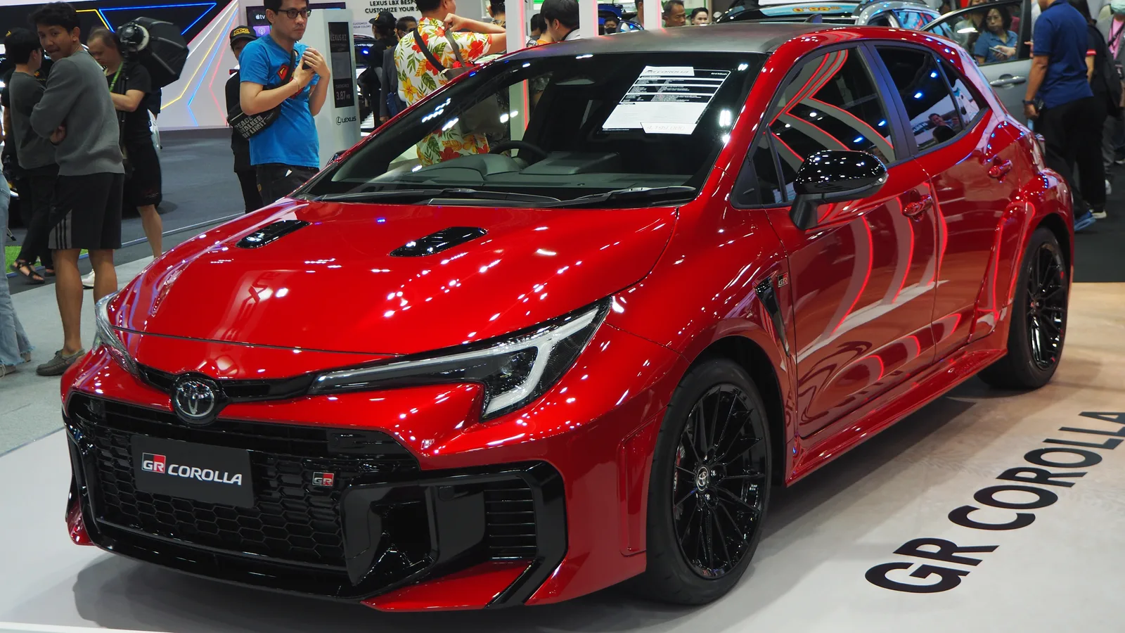 Toyota GR Corolla สีแดง บนบูธในงานมหกรรมยานยนต์ ปี 2024