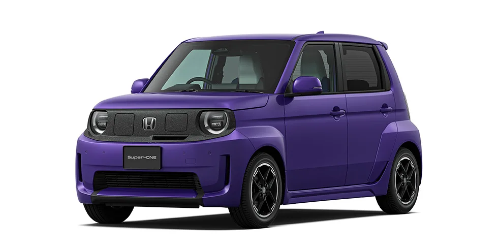 Honda Super-ONE สีม่วง มุมหน้าสามส่วน เห็นไฟหน้ากลมและกระจังหน้าแบบ EV
